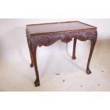 A mahogany Irish Chippendale style silver table, with tray top and carved frieze, raised on cabriole