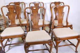 A set of five + one Georgian style mahogany dining chairs with carved vase shaped back splats,