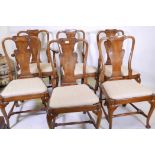 A set of five + one Georgian style mahogany dining chairs with carved vase shaped back splats,