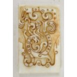 A Chinese carved jade tablet decorated with an exotic beast, 2" x 3½"
