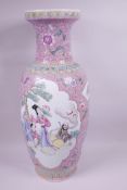 A large Chinese Republic period famille rose vase decorated with panels illustrating figures in a