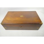 A C19th rosewood campaign writing box with brass cap corners and fitted interior