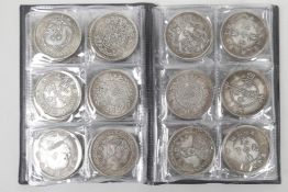 A Chinese facsimile (replica) wallet of sixty white metal coins, 1½" diameter