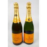 Two bottles of Veuve Clicquot champagne, one Ponsardin bi centenary and one brut