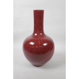 A Chinese flambe glazed bottle vase, 4 character mark to base, 14" high