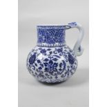 A Chinese blue and white porcelain Ming style jug with scrolling lotus flower decoration, 4