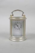 A silver plated miniature cylinder carriage clock, 3" high x 2½" diameter