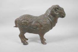 A Chinese bronze ram with raised dragon and carp decoration, with verdigris patina, 12" long