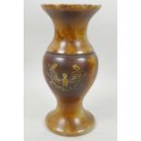 A Chinese carved hardstone vase decorated with phoenix rising from the flames and having detailed