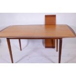 A Norwegian mid century teak extending dining table by Rolf Rastad and Adolf Relling for Gustav