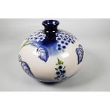 A large Florian ware Moorcroft style bulbous vase, 10½" high, 14" diameter