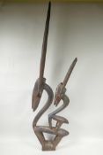 An African carved wood figure of two stylised antelope, 39" high