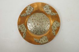 A Chinese copper dish/platter with applied white metal dragon and floral decoration, 9" diameter