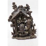 A vintage cast iron bear and beehive money bank, 5½" high