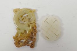 A Chinese carved and pierced jade pendant in the form of an auspicious symbol, and another carved in