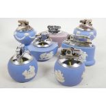 Six ceramic Ronson table lighters, blue Wedgwood pattern, and one ceramic mauve Wedgwood Ronson