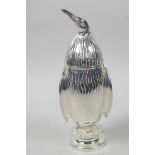 A novelty silver plated sugar sifter in the form of a penguin, 7½" high