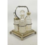 A silver plated and cut glass four section condiment set, 8½" high