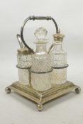 A silver plated and cut glass four section condiment set, 8½" high