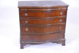 A mahogany serpentine fronted four drawer chest, with pullout slide, raised on ogee bracket feet,
