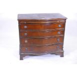 A mahogany serpentine fronted four drawer chest, with pullout slide, raised on ogee bracket feet,