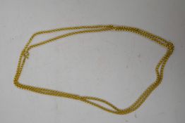 A brass Albert style chain, 56" long