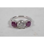 An 18ct white gold, ruby and diamond set three stone ring, approximately 1.5cts, approximate size '