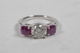 An 18ct white gold, ruby and diamond set three stone ring, approximately 1.5cts, approximate size '