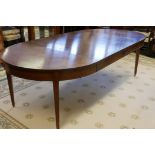 An American cherrywood draw leaf dining table raised on square tapering supports, with two leaves,