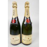 Two bottles of Moet and Chandon champagne, one Brut Imperial and one Premiere Cuvee