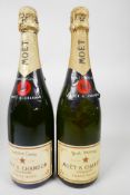 Two bottles of Moet and Chandon champagne, one Brut Imperial and one Premiere Cuvee