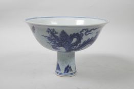 A Chinese blue and white porcelain stem bowl decorated with twin dragons, 6 character mark to