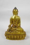 A Sino-Tibetan gilt bronze of Buddha seated on a lotus throne, impressed double vajra mark to