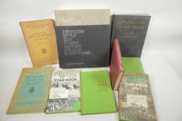 A quantity of books, mainly various motorcycling yearbooks, and Cars by Stephen Bayley