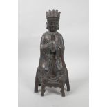 A Chinese gilt and bronzed metal figure of a seated dignitary, 12½" high, 6 character mark verso