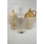 A glass chemist's bottle and stopper, 14" high, together with an earthenware cider bottle and a