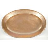 A large antique oval copper tray, 30" x 20"