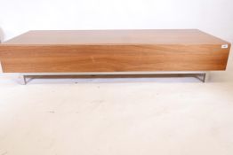 A contemporary veneered low media table/coffee table with a fall front, 60½" x 23½", 12" high