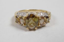 A 10ct yellow gold, tourmaline and diamond set dress ring, approximate size 'P'