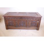 A C17th carved oak three panel coffer, 53" x 22", 24" high