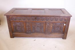 A C17th carved oak three panel coffer, 53" x 22", 24" high