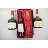 A bottle of Frapin Superior Old Grande Champagne Cognac in a presentation box with two glasses,