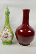A bulbous sang de boeuf glazed pottery vase, 14" high, together with a colourful vase and cover,