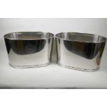 A pair of oval plated champagne coolers engraved with aphorisms from Lily Bollinger and Napoleon,
