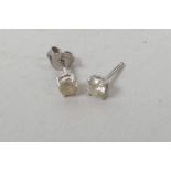 A pair of white gold set diamond stud earrings