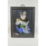 A Chinese reverse painting on glass of a child with a mantis, 14" x 18", frame A/F