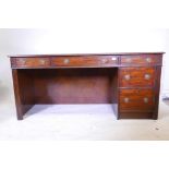 A contemporary mahogany desk, with three drawers over two, 64" x 25" x 30"