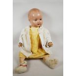 A rare C19th large Armand Marseille of Germany porcelain bisque head doll, used as an advertising