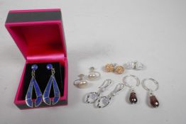 Six pairs of assorted silver earrings