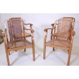A set of four Art Deco walnut open armchairs, with carved backs and seats